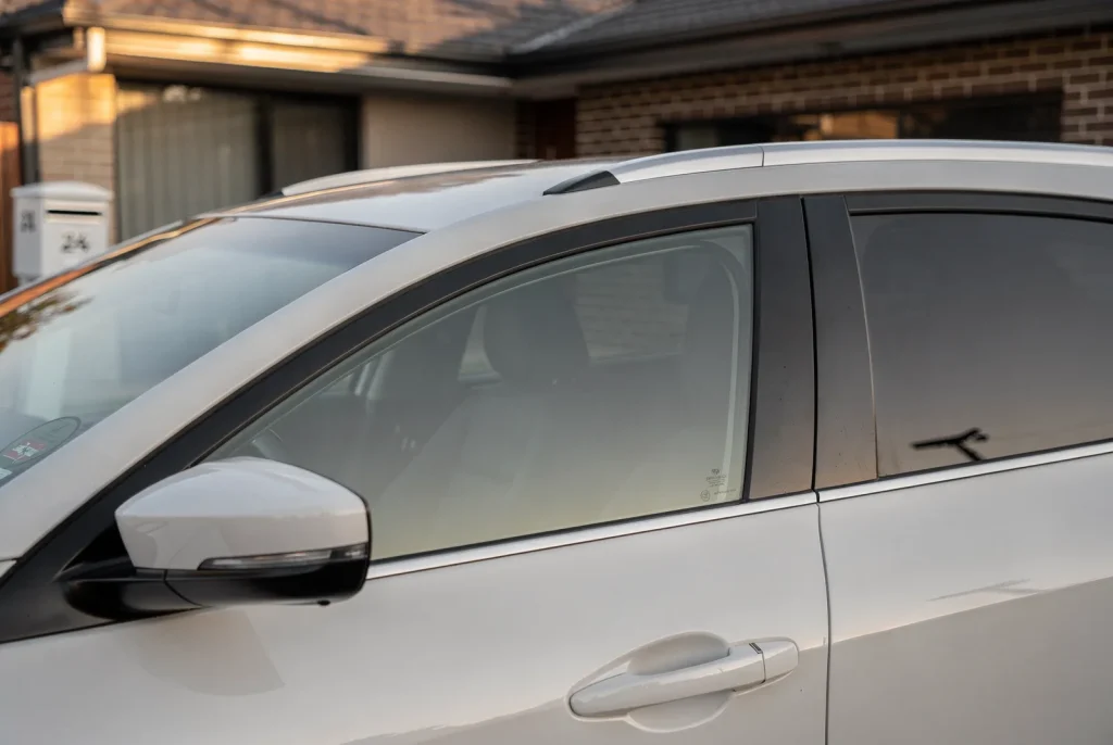 Freshly detailed car gleaming in a Perth home driveway.